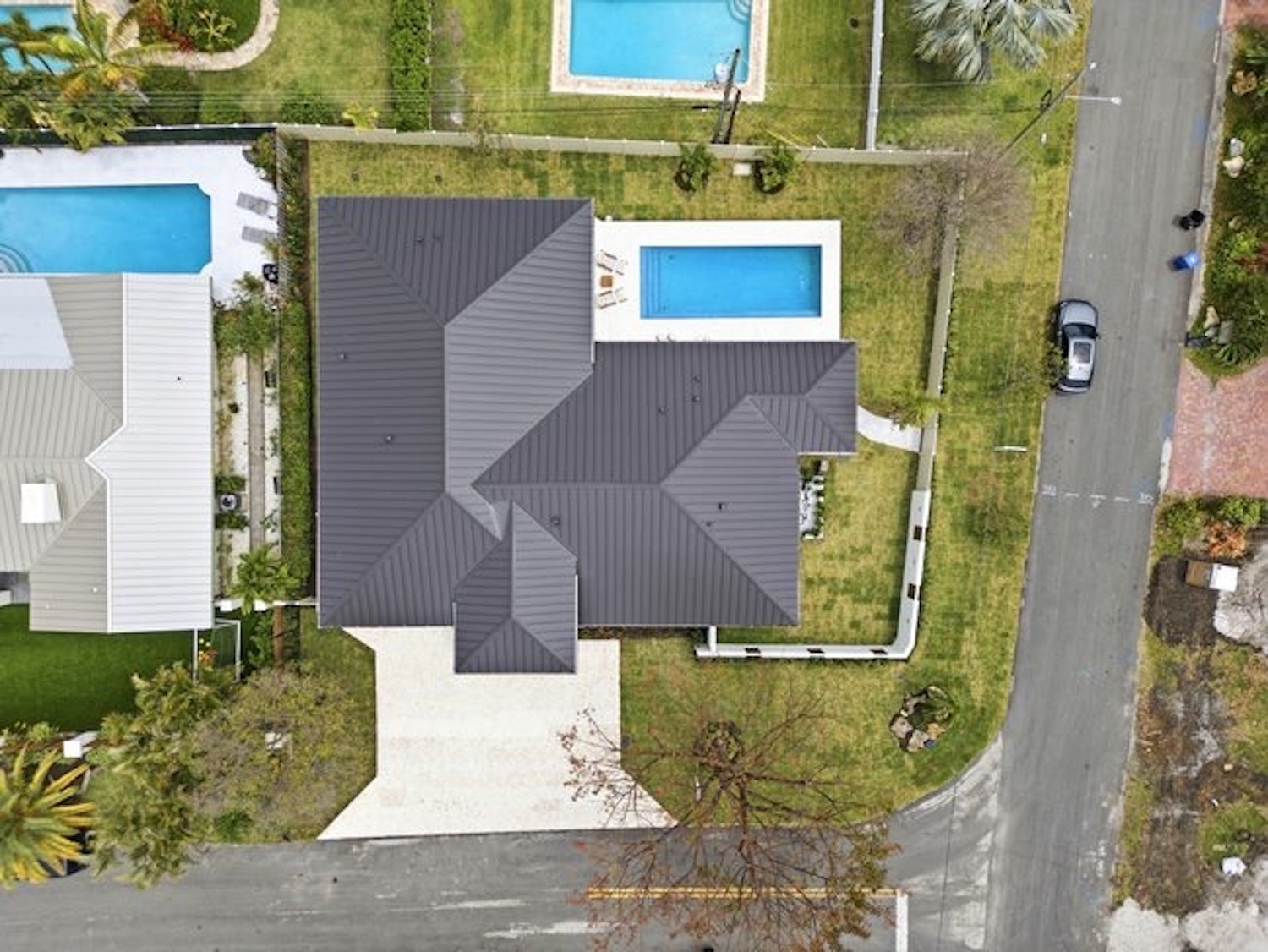 Aerial view of home with metal roof