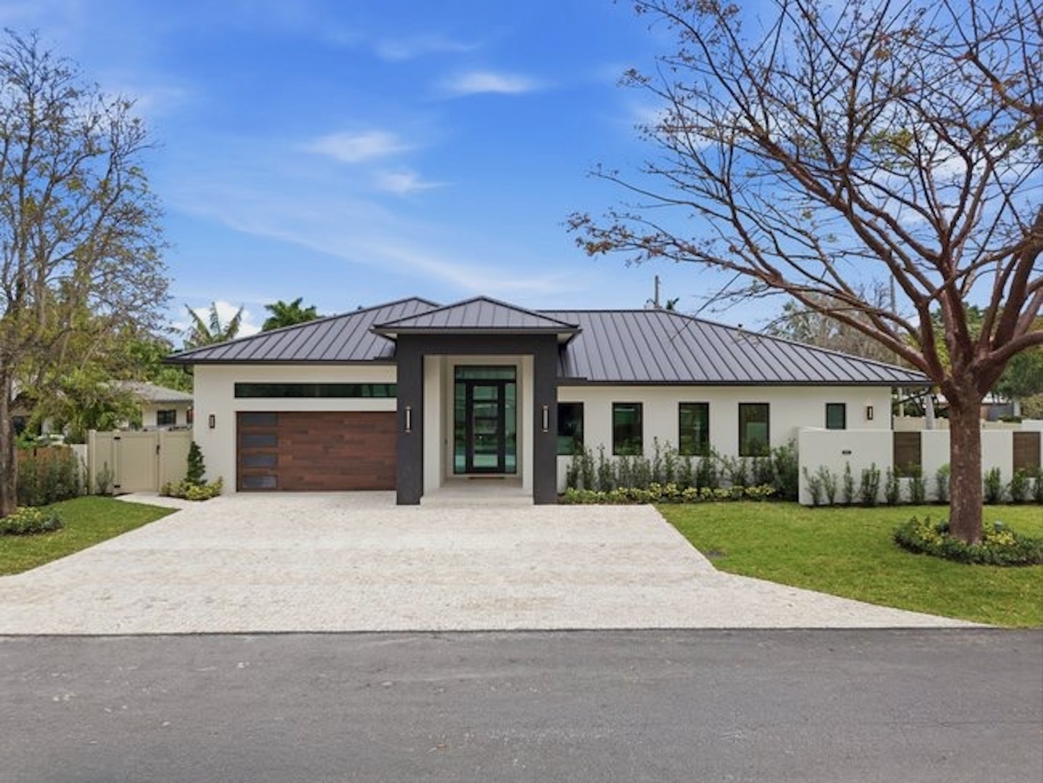Modern home front view with metal roof