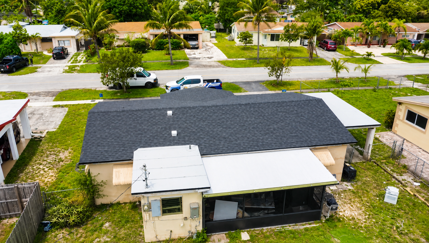 Aerial view of residential property with shingle roof