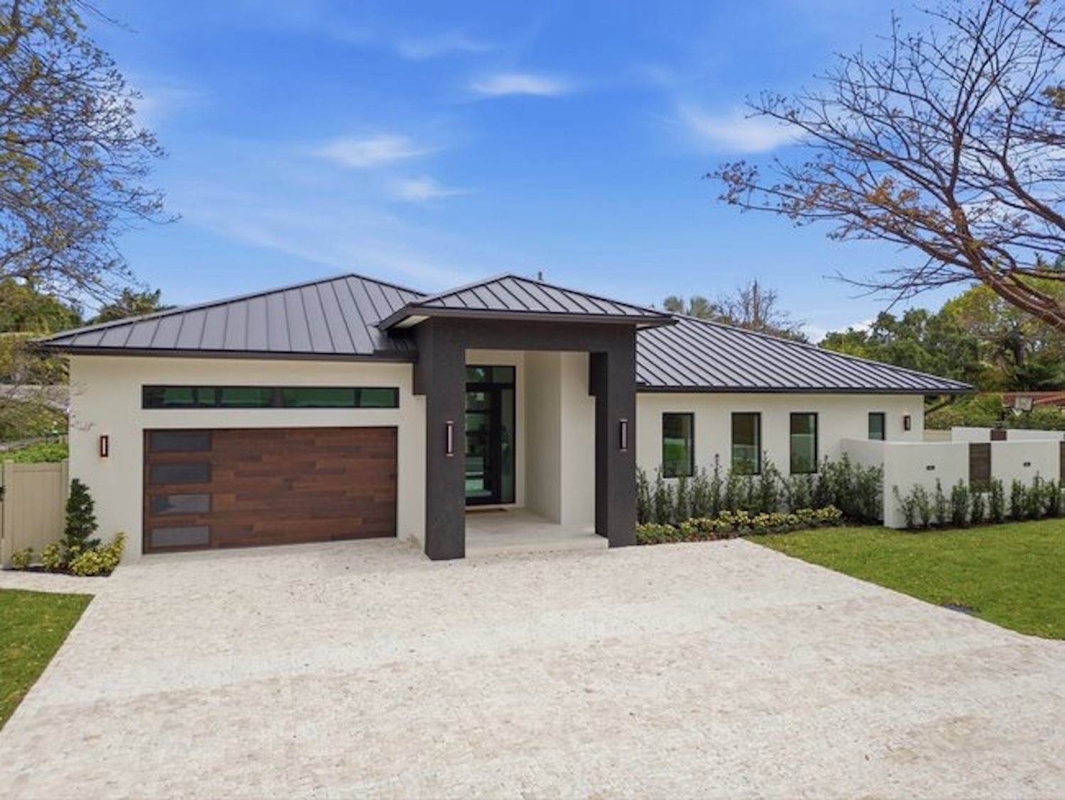 Modern home front view with metal roof